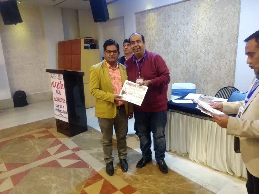 Dr. Tarun Kalra receiving recognition at the 20th IACDE PG Convention